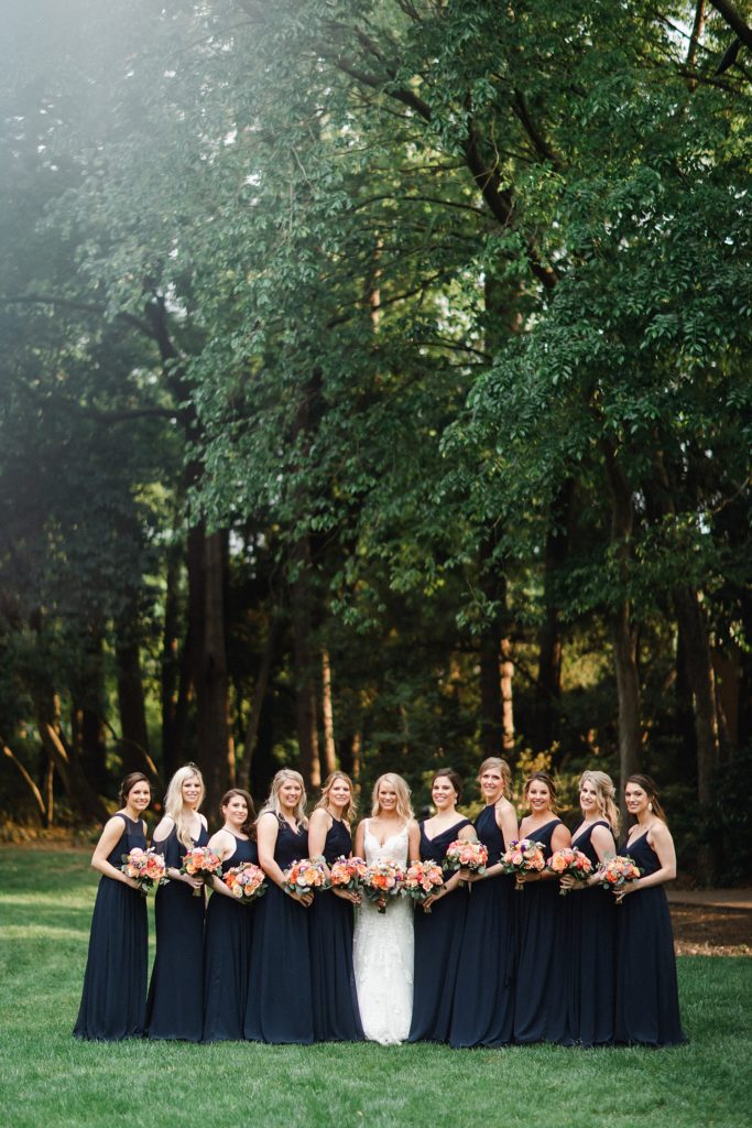 Bride and bridesmaids group picture in their dresses before the wedding