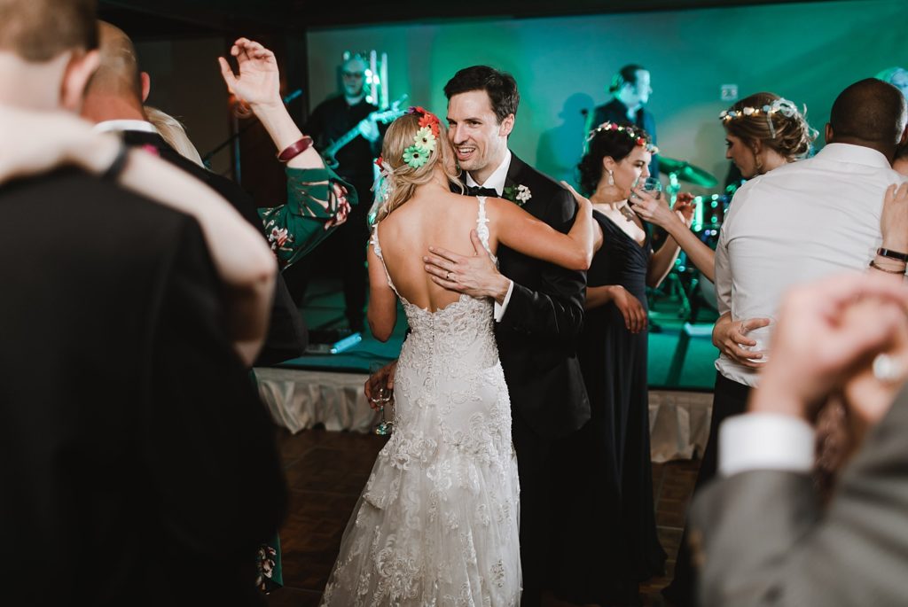 Bride and Groom enjoy the dance floor of their colorful floral wedding at the Houstonian