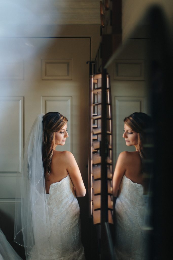 Bridal portrait in mirror on her wedding day in Napa Valley