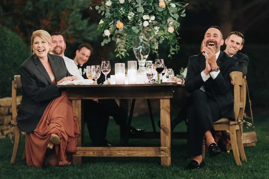 Guests enjoying speak at outdoor reception at Napa Valley wedding