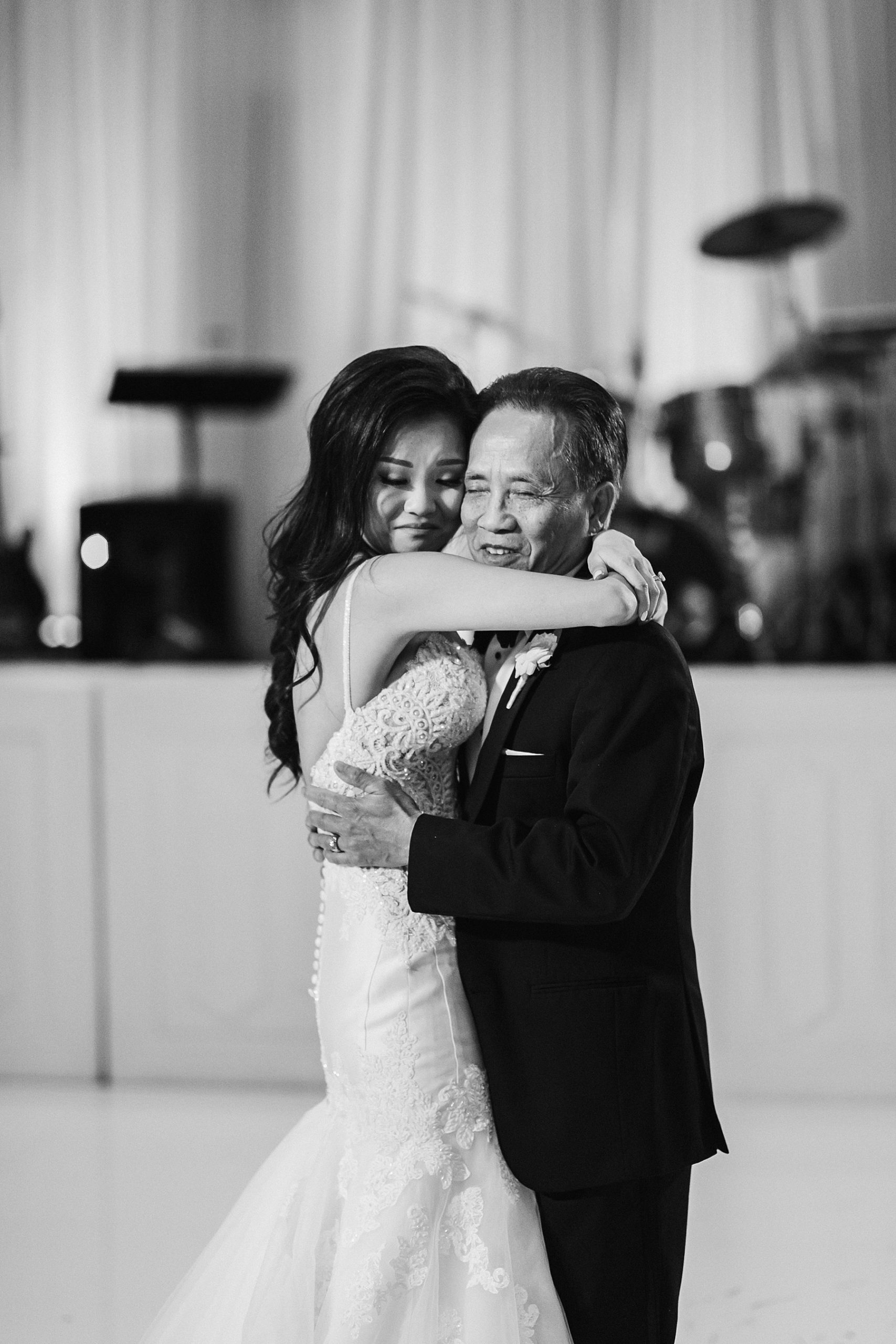 Loving embrace between the bride and her father at the Four Seasons Hotel