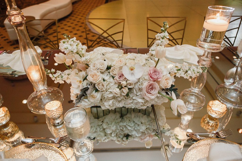 elegant table setting with flowers and candles in the omni hotel ballroom