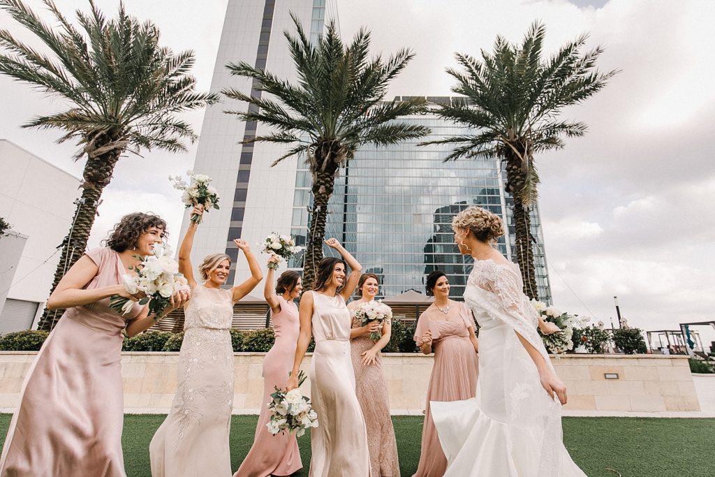 Bride and Bridesmaids celebrate post wedding ceremony in Houston