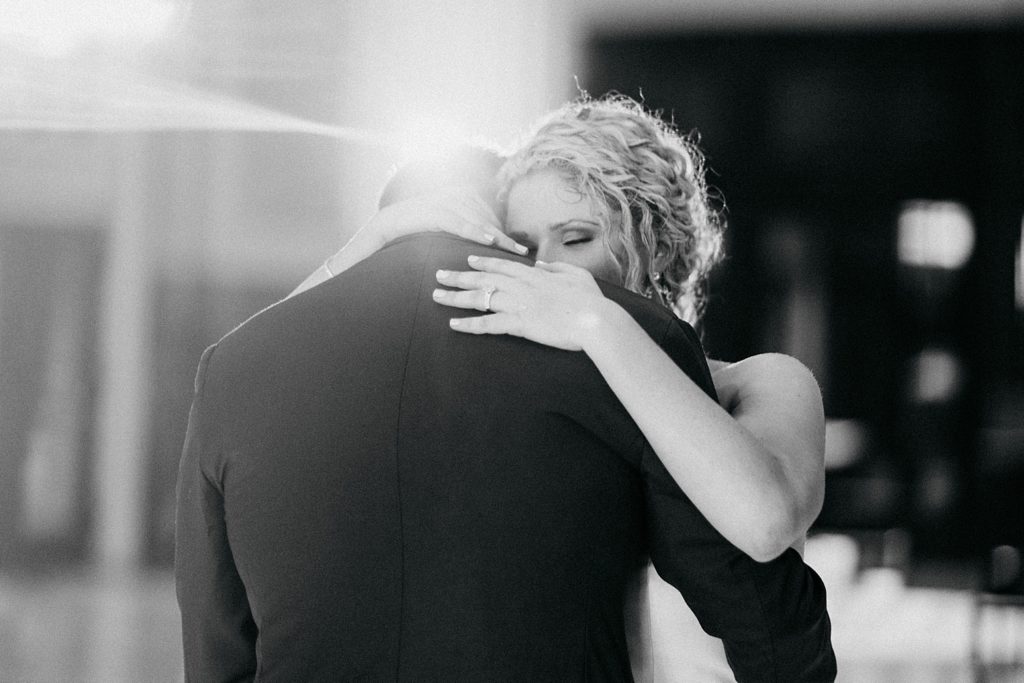 Black and white picture of the Bride and Grooms first dance at their wedding reception at The Minute Maid Park Houston