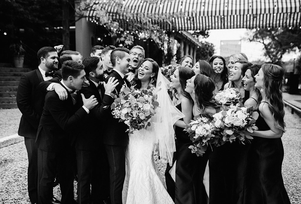 Wedding parties celebrate the newly weds at their glamorous wedding in Houston, Texas.