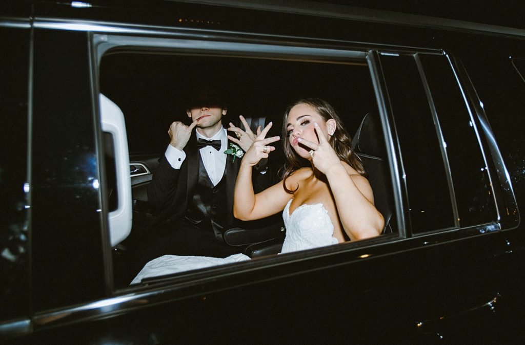 Couple drive away from their glamorous wedding reception at the Hotel ZaZa in Houston, Texas.